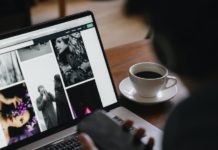 Crop person with smartphone against photos on laptop screen