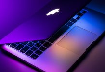 slightly opened silver MacBook