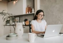 Focused young businesswoman working remotely at home