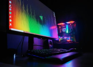 black flat screen computer monitor turned on beside black computer keyboard